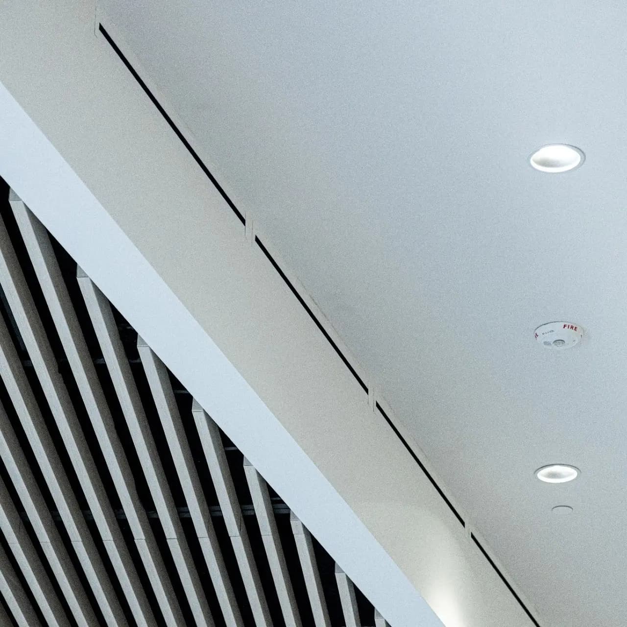 Architectural ceiling and baffle detail in a finished commercial interior