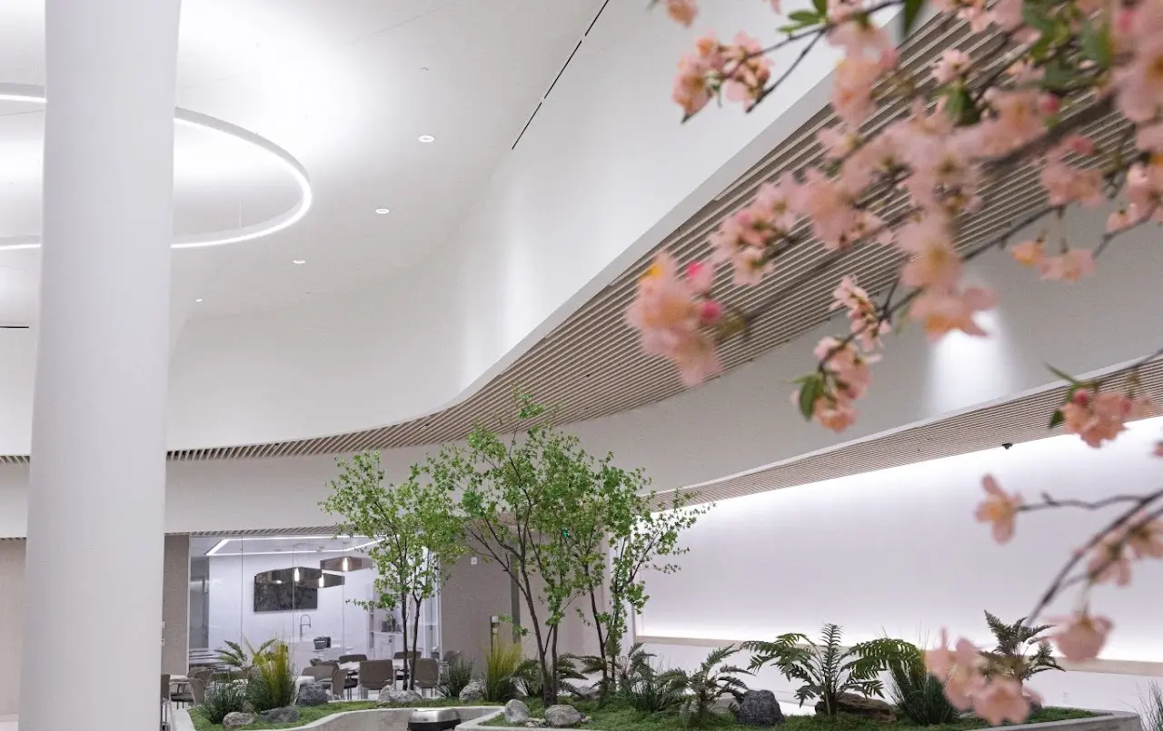 Finished lobby atrium with a curved wood-slat ceiling in a Bay Area commercial tenant improvement