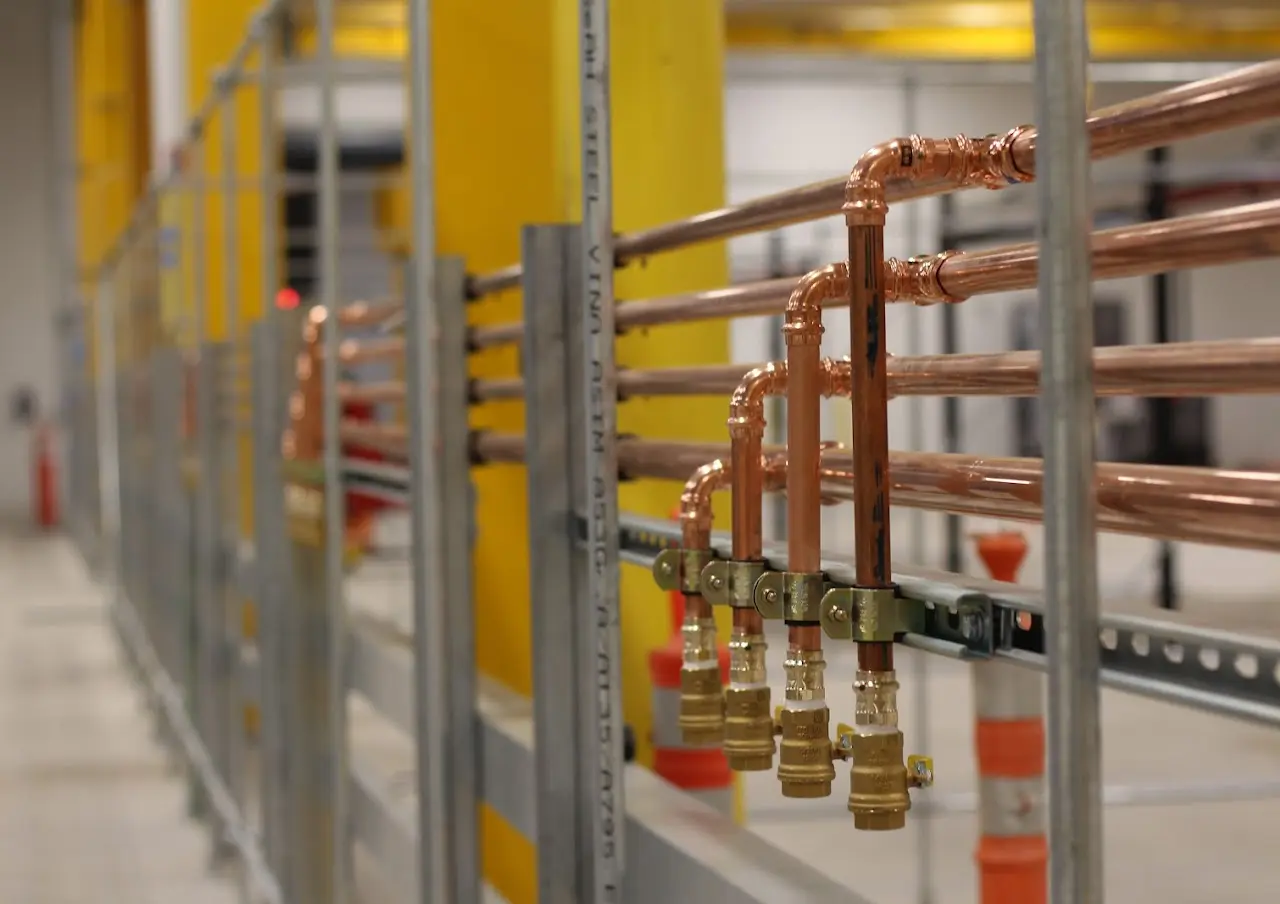 Overhead process piping installation by T3 Mechanical in a Bay Area industrial facility