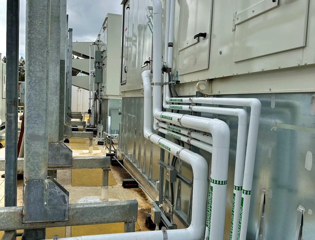 Insulated refrigerant piping on rooftop HVAC equipment at a Bay Area commercial facility